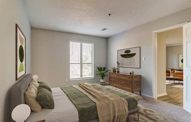 a bedroom with a bed and a dresser and a window