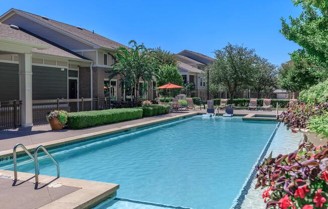 a large pool of water in front of a house