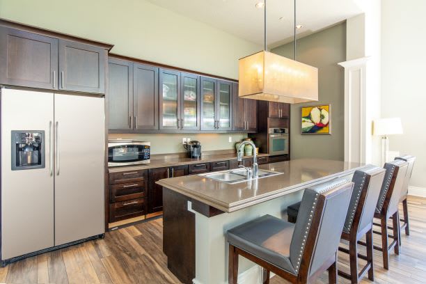 Clubhouse Kitchen with Island and Double Door Refrigerator at San Tropez Apartments & Townhomes, South Jordan