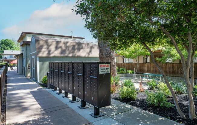 View of mail area with courtyard behind and picnic table