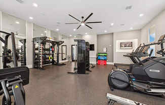 Community Fitness Center with Equipment at Alta 3Eighty Apartments located in Aubrey, TX.