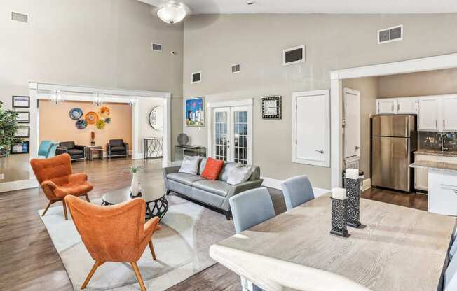 Leasing office lounge area with couch and chairs at Hunters Chase in Austin, TX