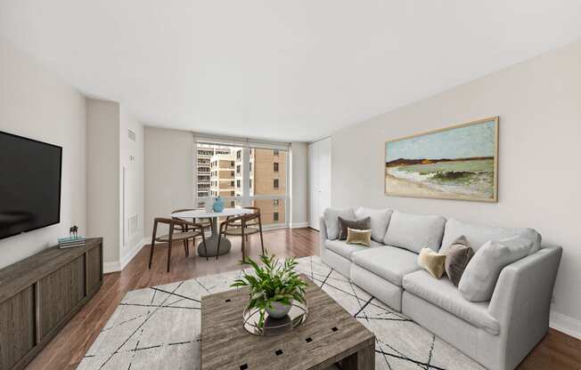 a living room with a couch and a table and a tv
