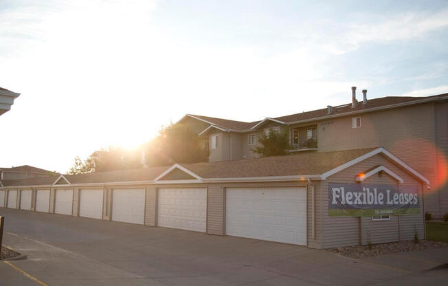 Large driveway with detached garage parking.