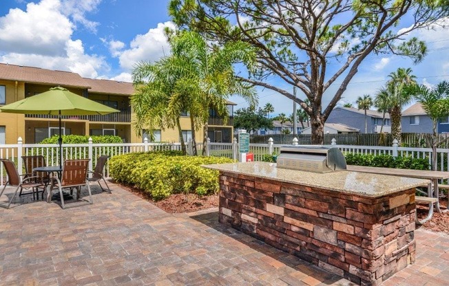 Outdoor grill with pool at Bay Club, Bradenton, Florida