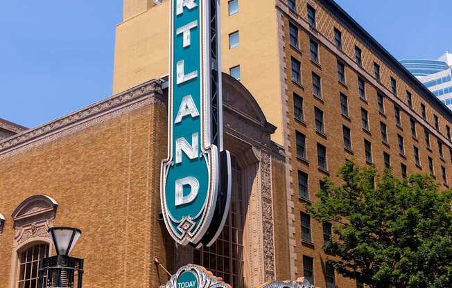 The Portland building has a blue and white sign on it.
