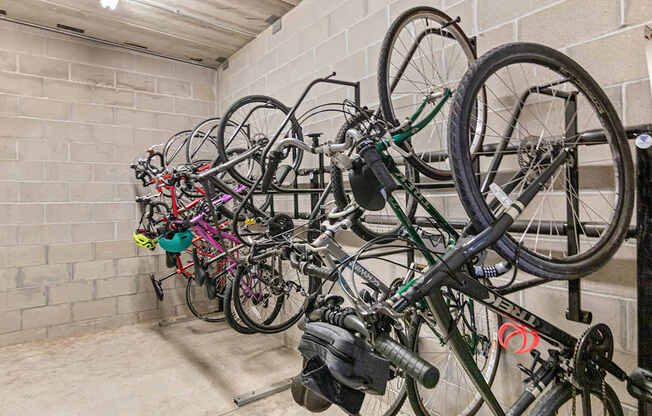 A bike rack full of bicycles in a garage.