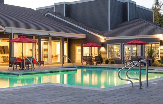 Evening pool view with seating  l Kirker Creek Apartments