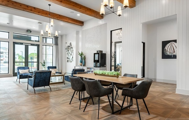 a dining room with a wooden table and chairs