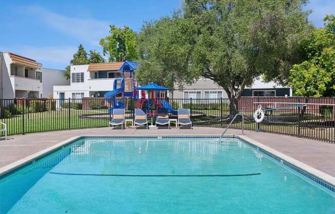 A swimming pool with lounge seating