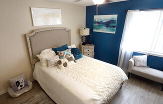 bedroom with overhead light and a window