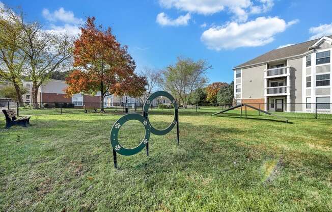 the preserve at ballantyne commons park with a playground and apartment buildings