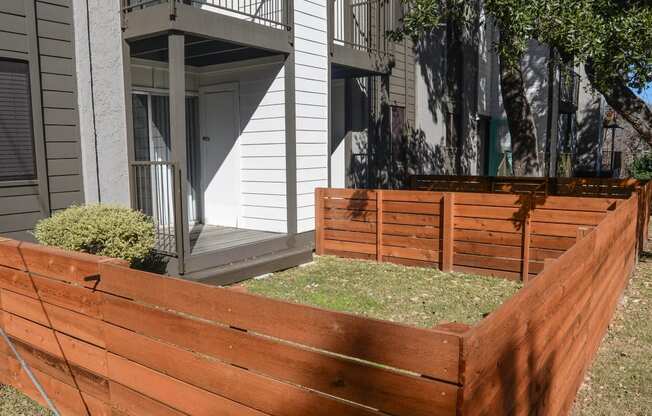 a wooden fence in front of a house