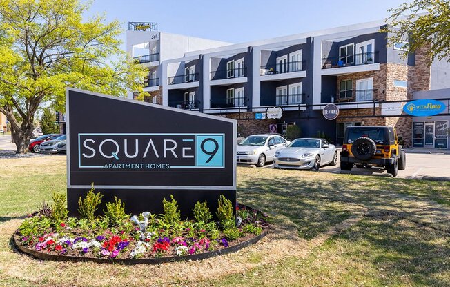 a building with a square 9 sign in front of it