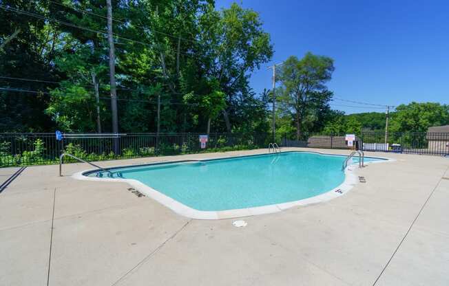 Outdoor pool surrounded by trees