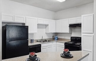 Kitchen with appliances at Tidwell Estates in Houston TX