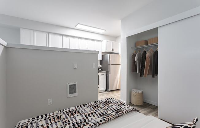 a bedroom with a bed and a closet