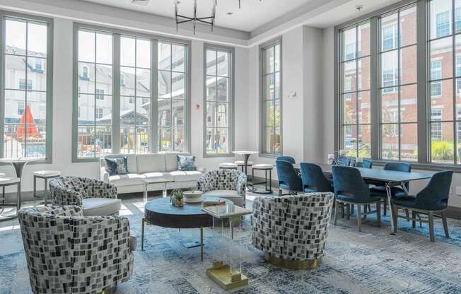 A modern living room with a large window and a view of a construction site outside.