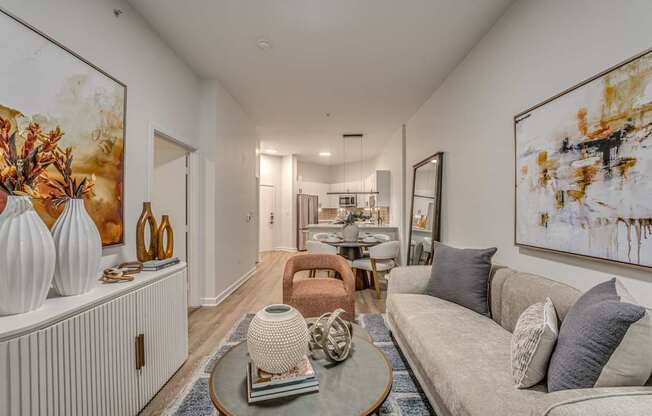 A living room with a grey couch and a coffee table.