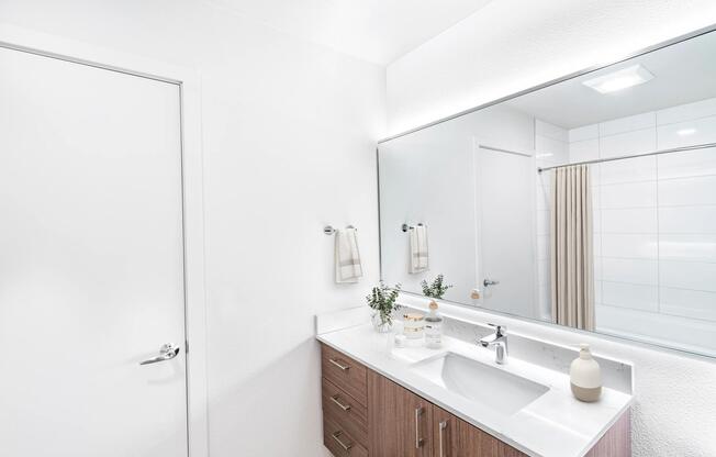 A bright bathroom with a streamlined vanity, integrated lighting, and clean finishes that create a fresh, uncluttered feel.