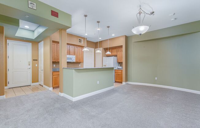 Upgraded 4th floor unit in upscale guard gated community just South of the Strip