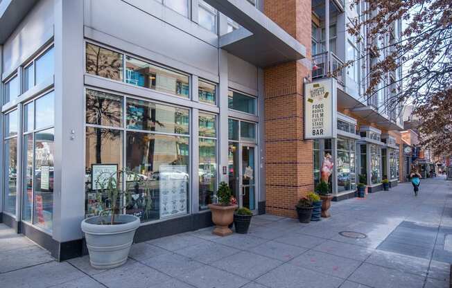 A street view of a building with a sign that says
