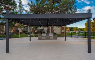 a covered park with a bench in front of a building