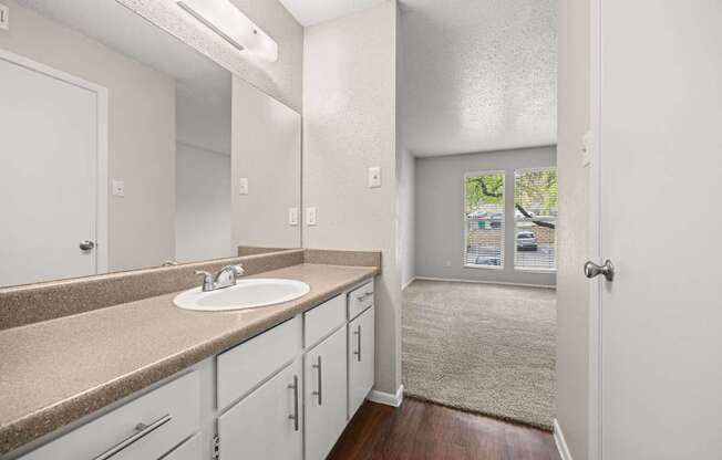 A bathroom with a sink and mirror. at Montecito, Austin, Texas