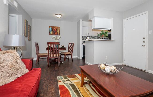 a living room filled with furniture and a rug