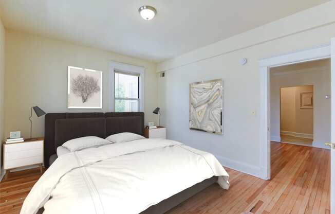 Bedroom with bed, nightstands, and large closet  at twin oaks apartments columbia heights washington dc