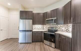 Upscale Stainless Steel Kitchen Appliances With Double Door Refrigerator at Residences at 3000 Bardin Road, Grand Prairie, TX, Texas, 75052