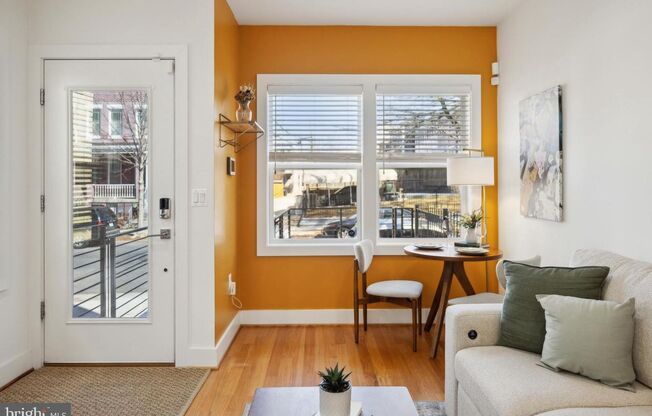 Welcome to 1181 Neal Street NE, a stunning 3-level townhome offering a private rooftop deck with breathtaking skyline views and off-street parking.