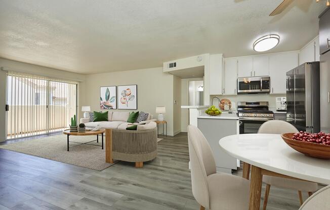 a living room filled with furniture and a table