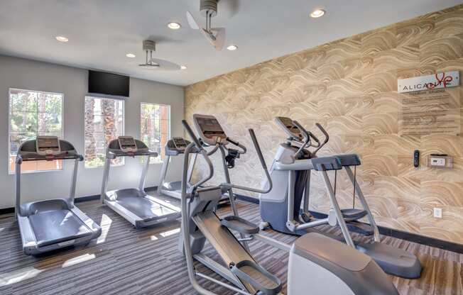 Spring Valley, NV Apartments - Alicante - Fitness Center with Treadmills, Elliptical Machines, and Large Windows