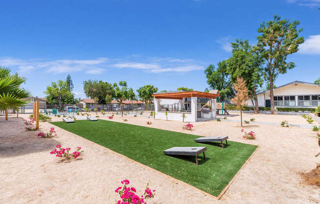 A park with a playground and a picnic table.