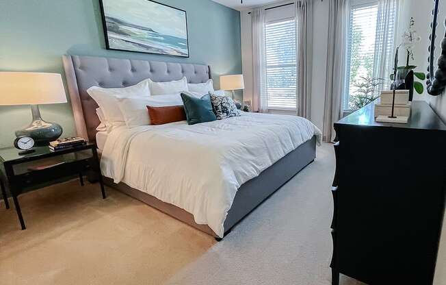 Model bedroom with large bed and lots of light  at Two Addison Place Apartments , Georgia