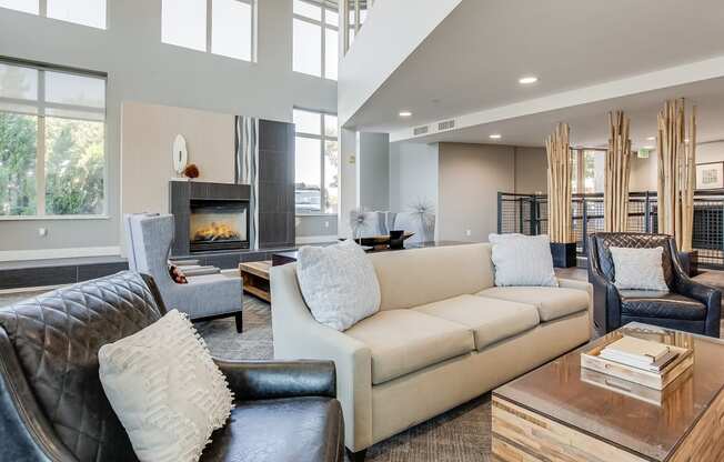 a living room with couches and chairs and a fireplace