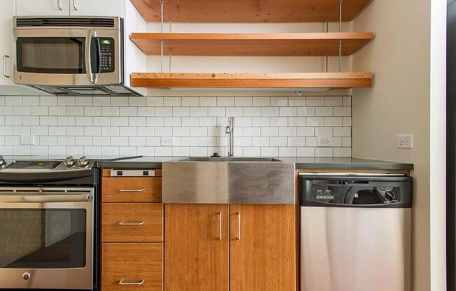 Fully Furnished Kitchen With Stainless Steel Appliances at Lower Burnside Lofts, Oregon