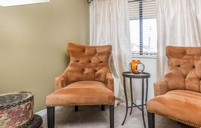 a living room with a leather chair