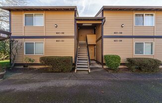 Updated 1 Bed / 1 Bath Upper-Level Condo with Balcony, Garage & A/C — Gated Community!