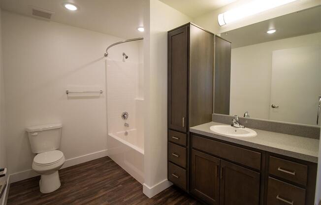 a bathroom with a toilet sink and shower at Loma Villas Apartments, San Bernardino, 92408