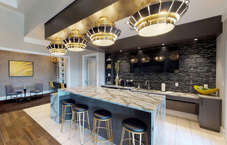 Clubhouse with bar area; flat screen TV; tables and chairs; resident lounge with fireplace