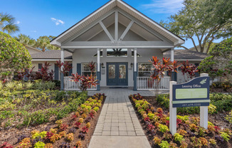 the entrance to a building with a sign in front of it