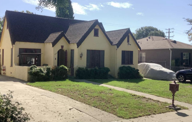 Charming 3 Bed/1.5 Bath Tudor with Spacious Yard, Garage And Classic Details