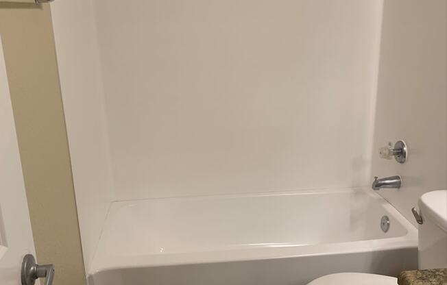 Bathroom with a Toilet and a Bathtub at Arcadia Townhomes, Federal Way, WA, 98023