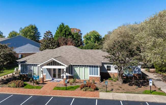 A building with a parking lot in front of it.