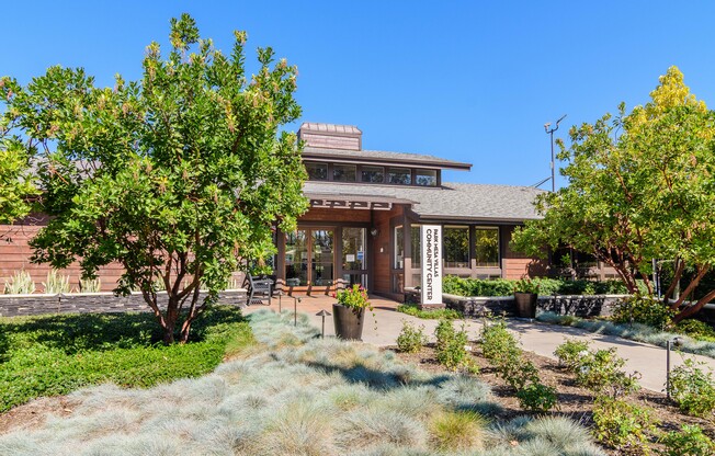 A building with a brown roof and a sign that says 