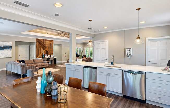 Clubhouse with a dining table, kitchen counter, coffee station, and lounge seating at Elevation 3505 in Atlanta, GA.