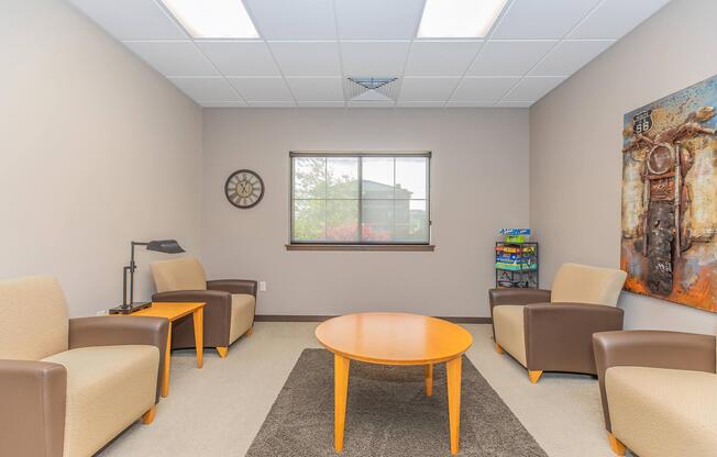 a bedroom with a desk and chair in a room