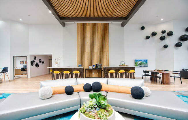 the lobby or reception area of a hotel with couches and tables at Presidio Palms Apartments, Arizona, 85701